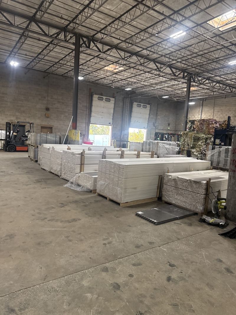 Pallets of boxed flooring in stock in the warehouse